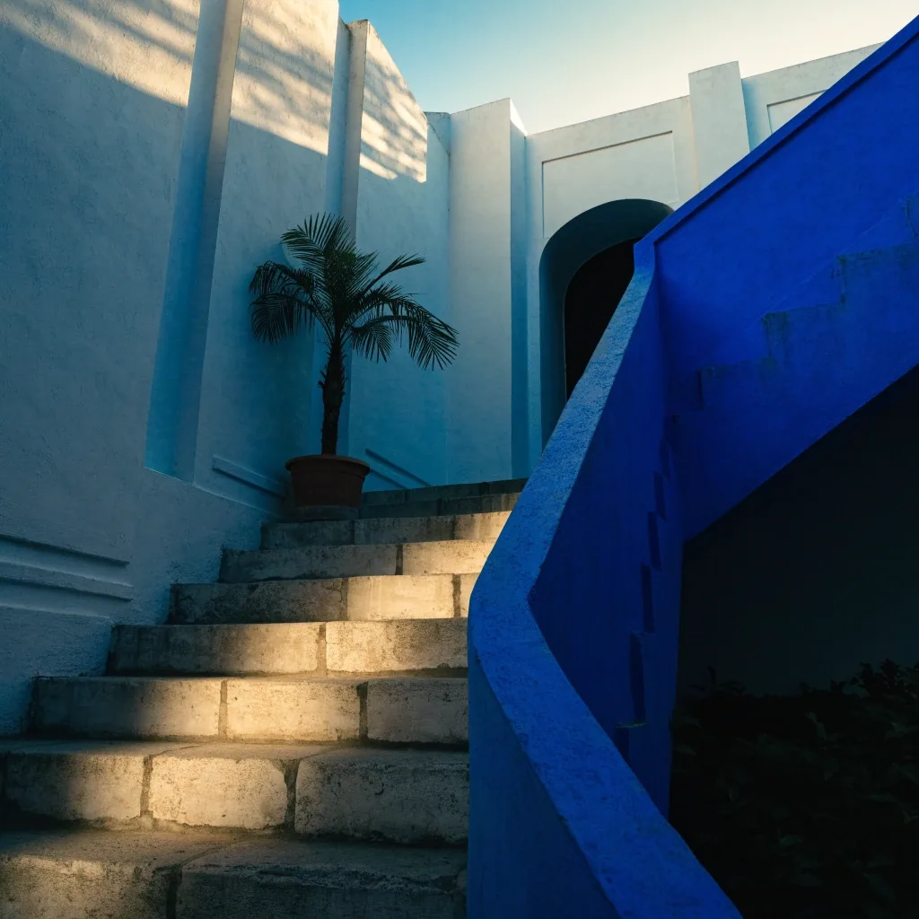 Blue staircase and shaded doorway of the villa in the Majorelle Garden