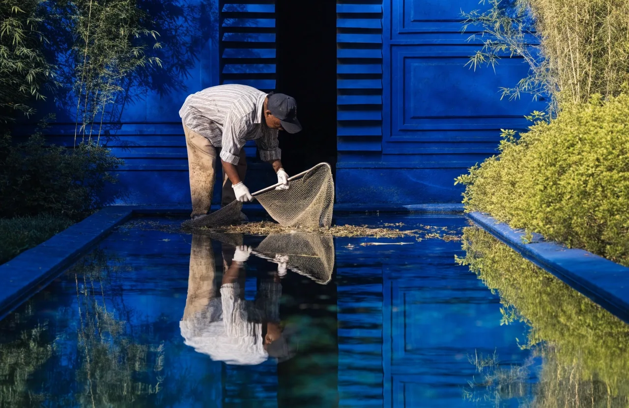 Long reflecting pool in front of the cobalt studio wall in the Majorelle Garden